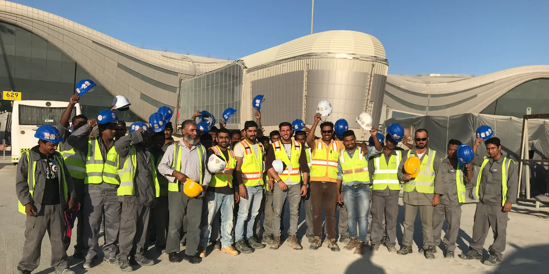 Art Island construction team outside an airport terminal
